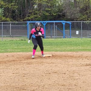 Action shot of Trinity running the bases.