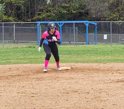 Action shot of Trinity running the bases.